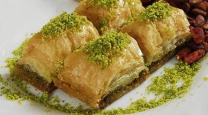 Baklava: a rich, sweet dessert pastry made of layers of filo filled with chopped pistachios and held together with sugar syrup.