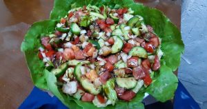 Salad: made of tomatoes, cucumbers, lettuce, salt, lemon salt, and olive oil.
