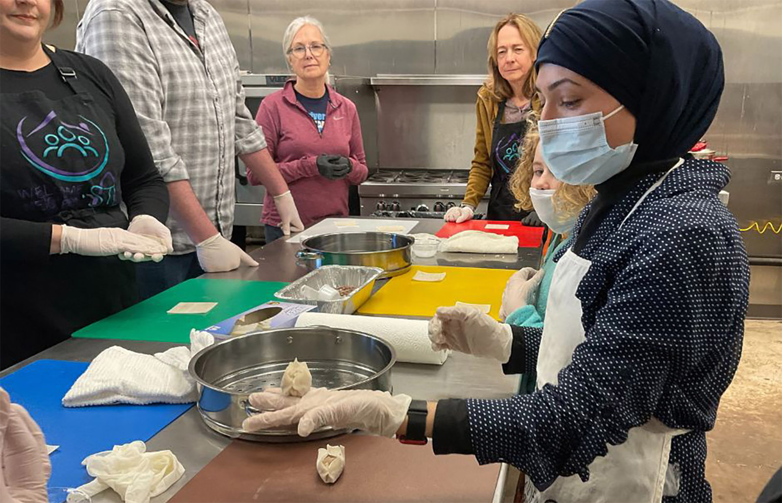 Cooking classes share classic recipes as part of Welcome Neighbor’s supper club program